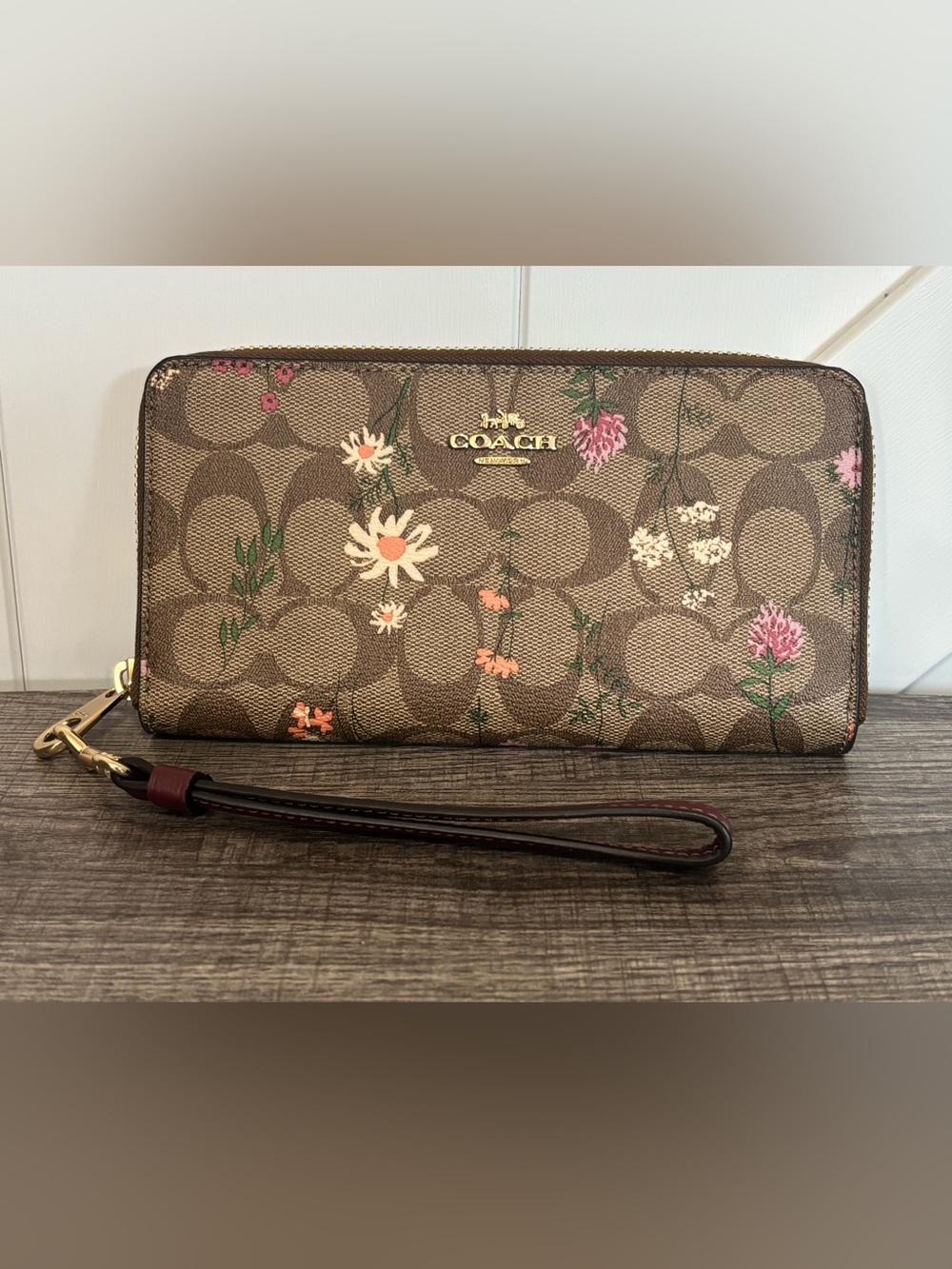 EUC Coach Long Zip Around Wallet in Signature Canvas with a Wildflower Print.